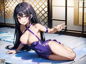 A woman in a purple bathing suit sitting on a blue mat.